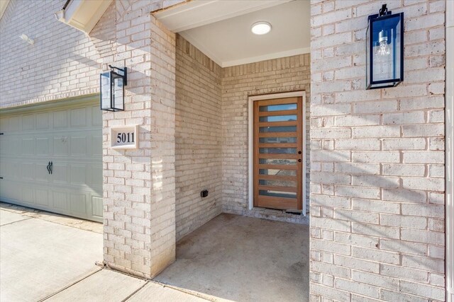 doorway to property featuring a garage