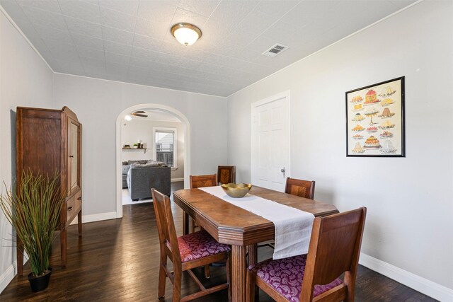 living room with dark hardwood / wood-style floors and ceiling fan