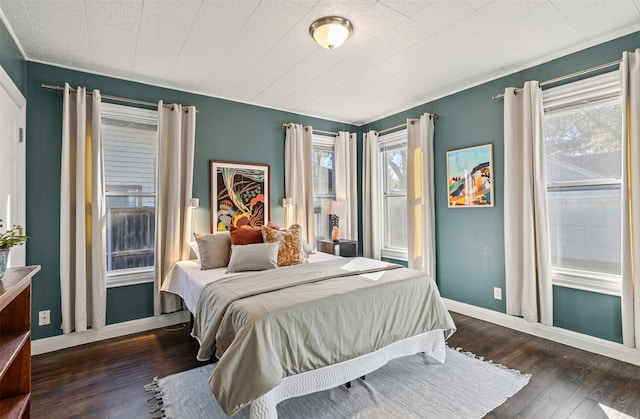 bedroom featuring dark hardwood / wood-style floors