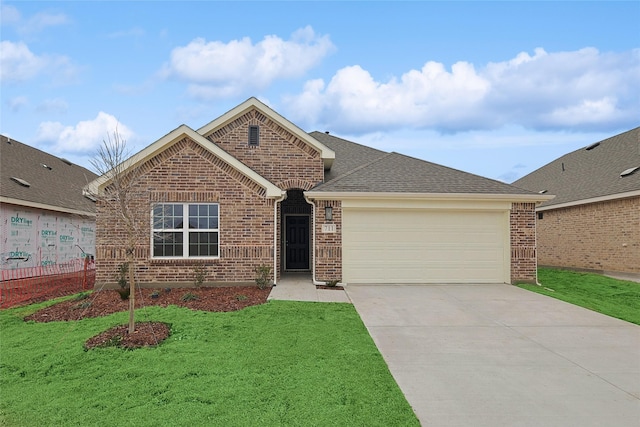 ranch-style house with concrete driveway, brick siding, an attached garage, and a front yard