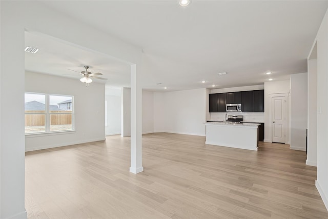 unfurnished living room with light wood-style floors, recessed lighting, visible vents, and ceiling fan