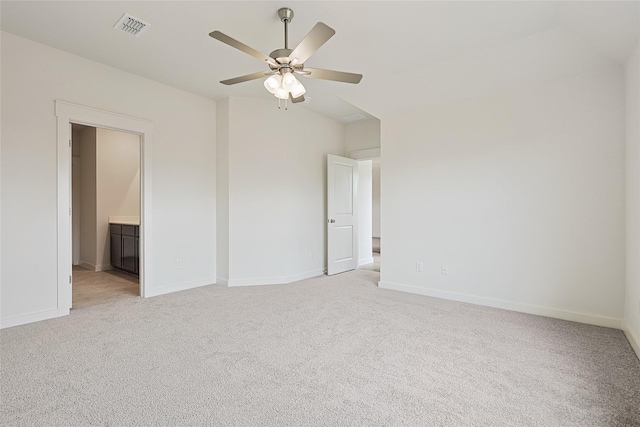 unfurnished bedroom with light colored carpet, visible vents, ceiling fan, and baseboards