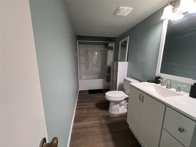 full bathroom with vanity, a textured ceiling, wood-type flooring, shower / bathtub combination with curtain, and toilet