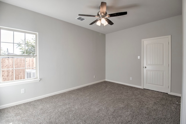 carpeted empty room featuring ceiling fan