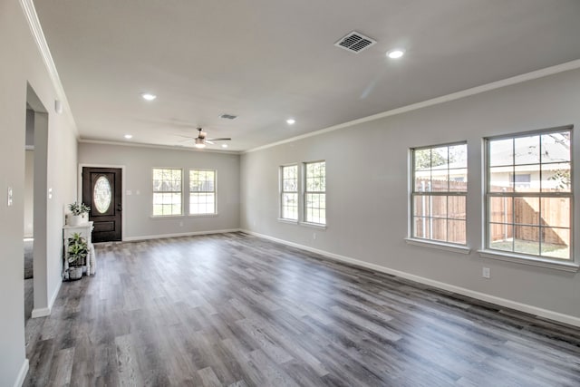 unfurnished living room featuring hardwood / wood-style floors, ceiling fan, and crown molding