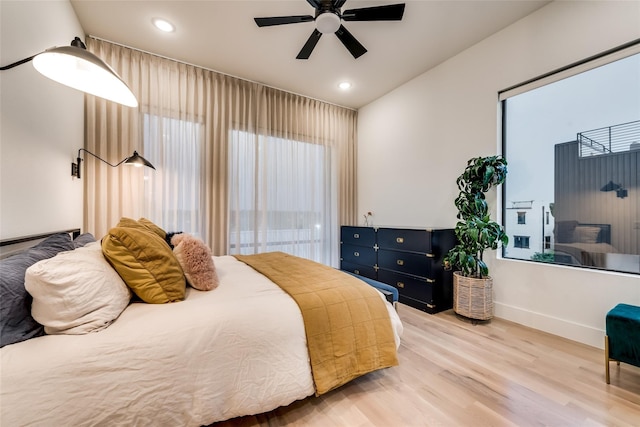 bedroom with ceiling fan and light wood-type flooring