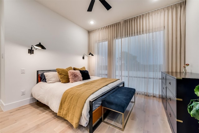 bedroom with light hardwood / wood-style floors and ceiling fan