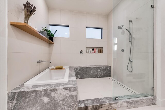 bathroom with sink and shower with separate bathtub