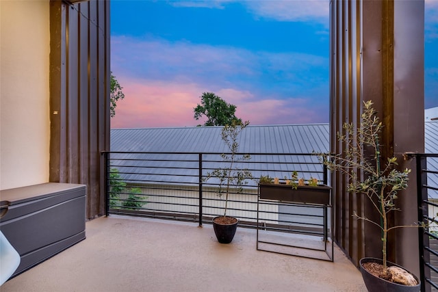 view of balcony at dusk