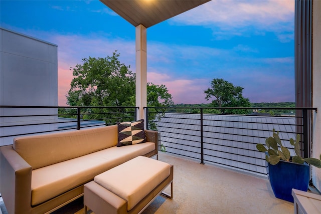 balcony at dusk featuring outdoor lounge area