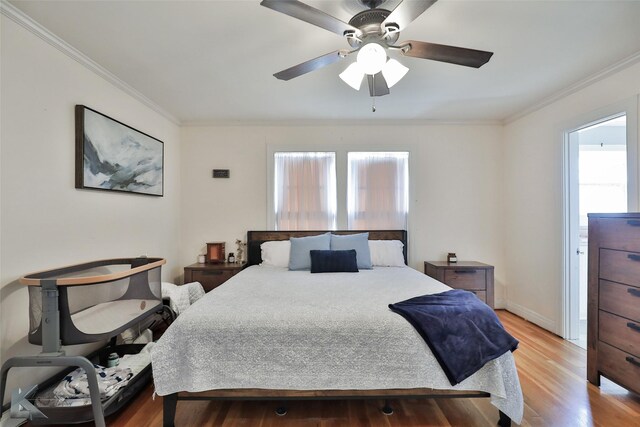 bedroom with ornamental molding, light wood-type flooring, and ceiling fan