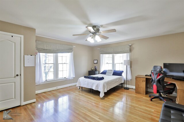 bedroom featuring light hardwood / wood-style floors and ceiling fan