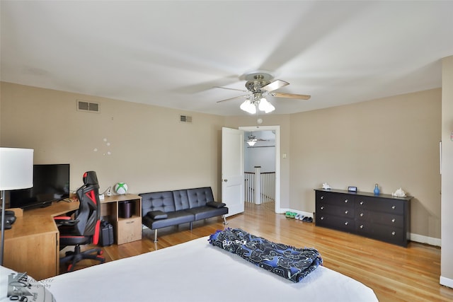 bedroom featuring ceiling fan and wood-type flooring