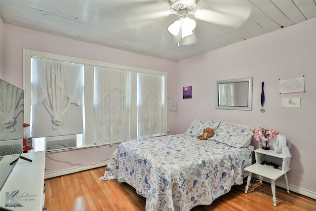 bedroom with hardwood / wood-style flooring and ceiling fan