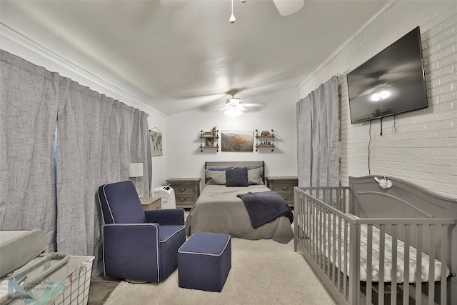 bedroom featuring ceiling fan, carpet, and ornamental molding