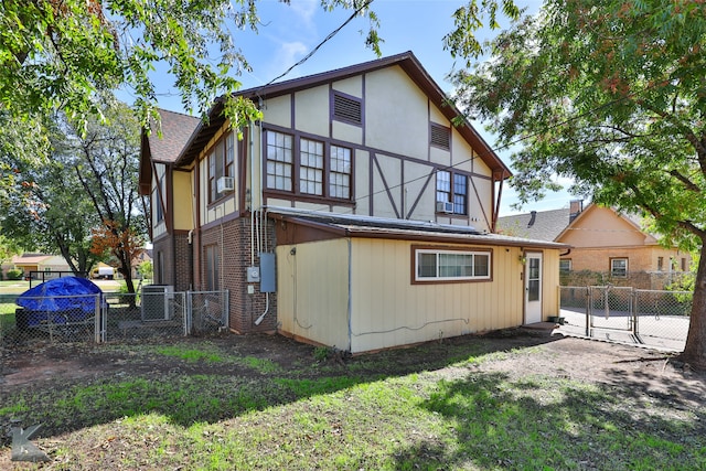 rear view of house with cooling unit