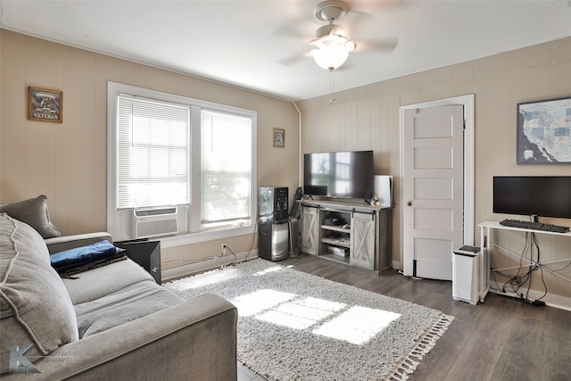 living room with dark hardwood / wood-style flooring, cooling unit, and ceiling fan