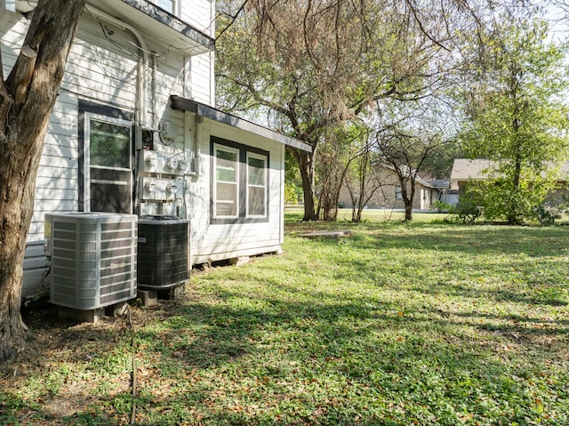 view of yard with central AC