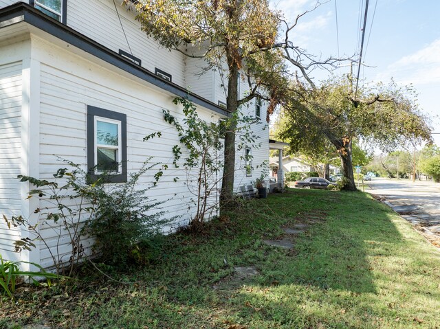 view of home's exterior featuring a yard