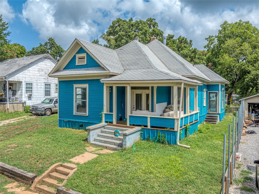 view of front of house featuring a front yard and covered porch