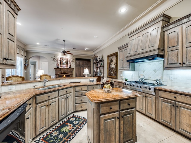 kitchen with light tile patterned floors, stainless steel gas cooktop, sink, and kitchen peninsula