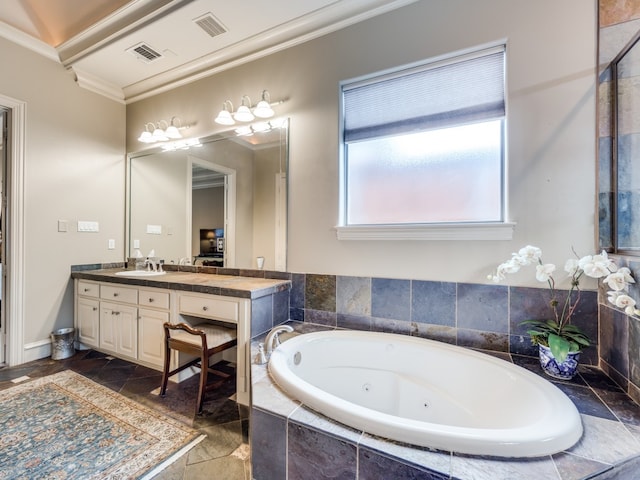 bathroom featuring ornamental molding, vanity, and tiled bath