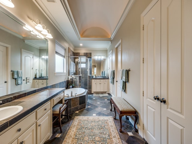 bathroom featuring vanity, crown molding, and independent shower and bath