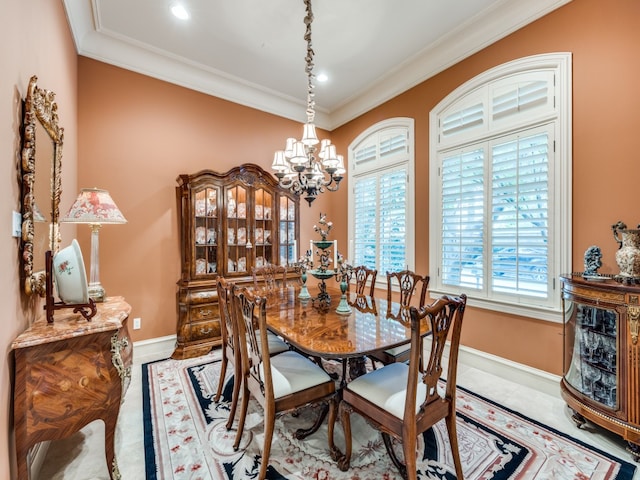 dining space with an inviting chandelier and ornamental molding