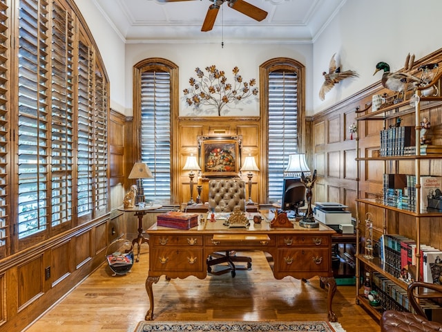 office featuring light hardwood / wood-style flooring, ceiling fan, and crown molding