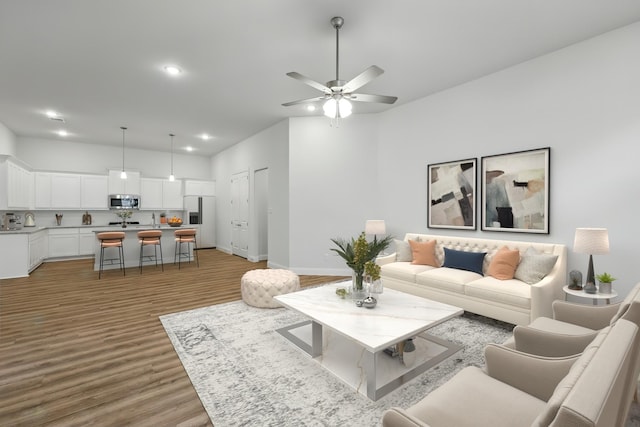 1813 Morning Mist Way, Mesquite, TX 75181 - living area with light wood finished floors, ceiling fan, recessed lighting, and baseboards