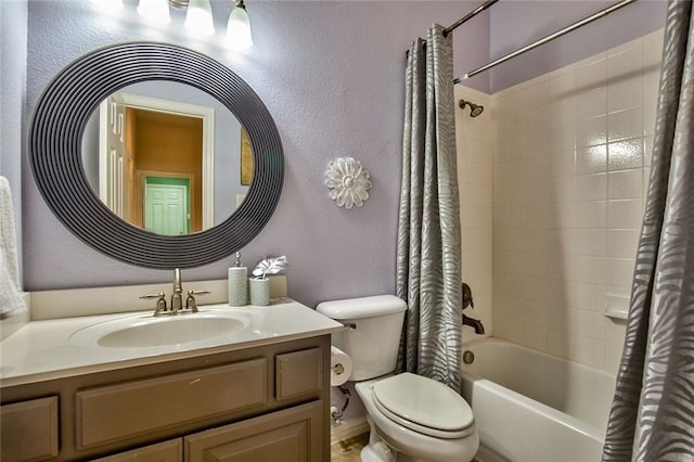 full bathroom with vanity, shower / bathtub combination with curtain, and toilet