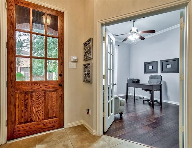 interior space with french doors, light hardwood / wood-style flooring, ceiling fan, and ornamental molding