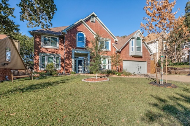 view of front of property featuring a garage and a front lawn