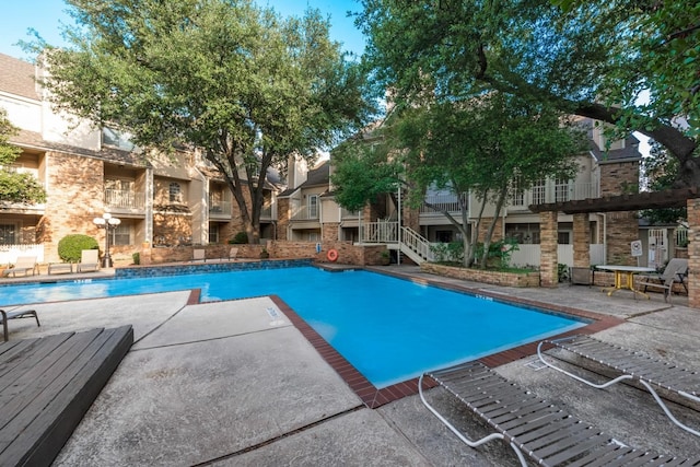 view of pool with a patio area