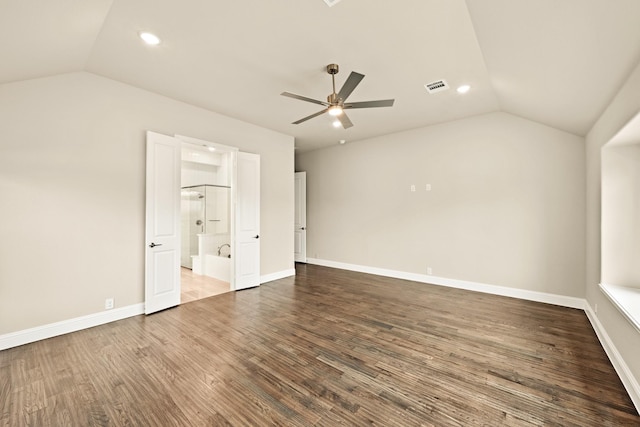 interior space with ceiling fan, wood finished floors, visible vents, baseboards, and vaulted ceiling