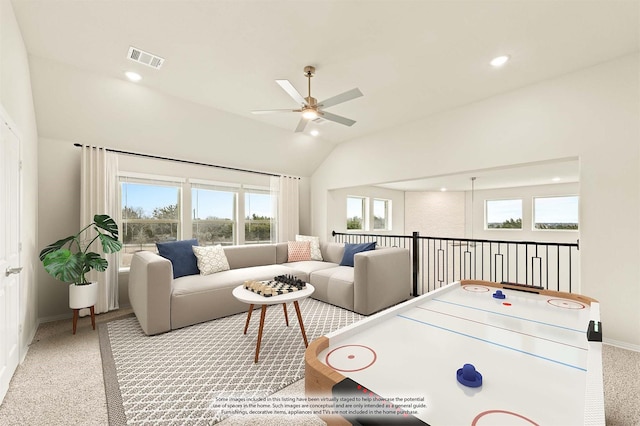 playroom featuring baseboards, visible vents, lofted ceiling, ceiling fan, and carpet flooring