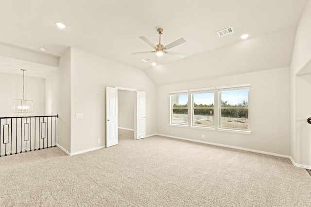 carpeted spare room with recessed lighting, visible vents, vaulted ceiling, baseboards, and ceiling fan with notable chandelier