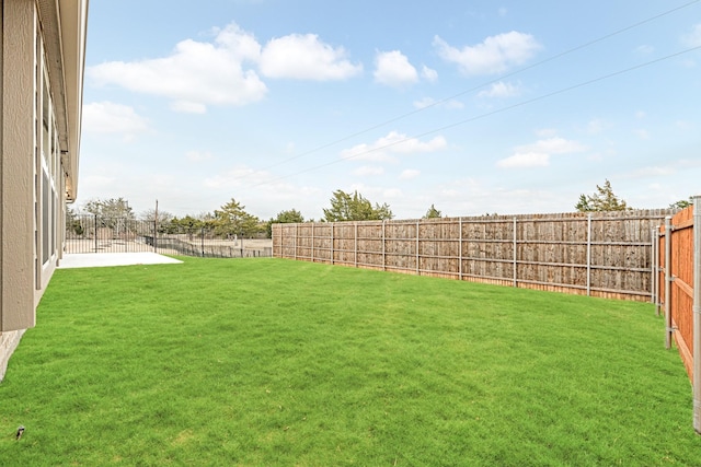 view of yard with a fenced backyard