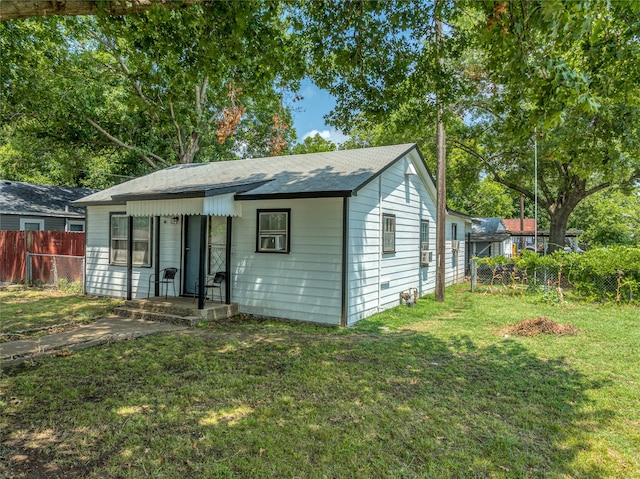 view of outbuilding with a yard