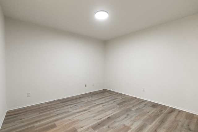 spare room featuring light hardwood / wood-style floors