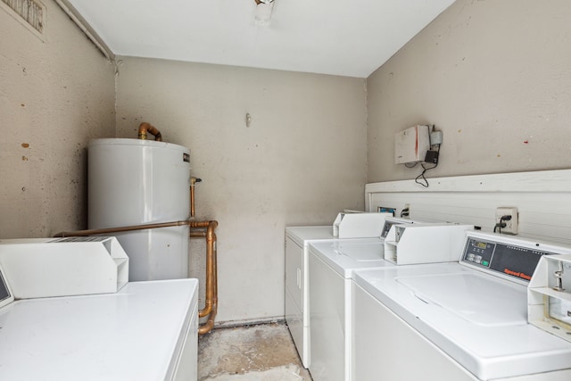 laundry area featuring washing machine and dryer and gas water heater