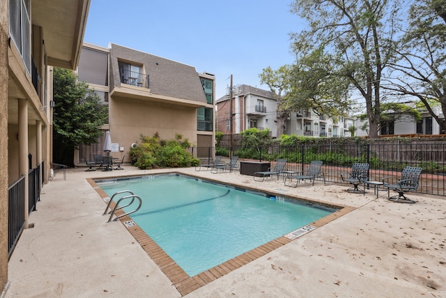 view of swimming pool featuring a patio