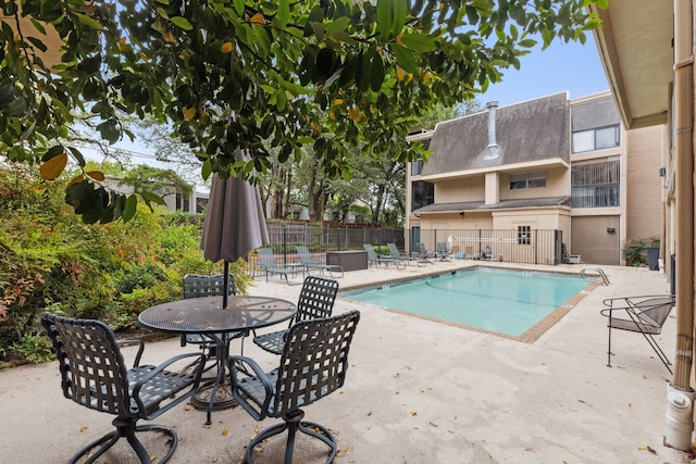 view of pool featuring a patio area