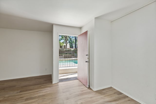 empty room with light hardwood / wood-style floors