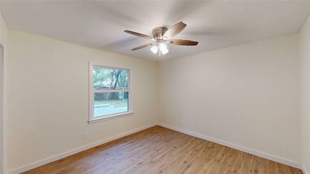 spare room with ceiling fan and light wood-type flooring