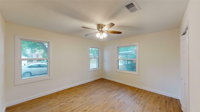 spare room with ceiling fan and light hardwood / wood-style flooring