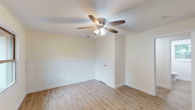 empty room featuring ceiling fan and light hardwood / wood-style floors