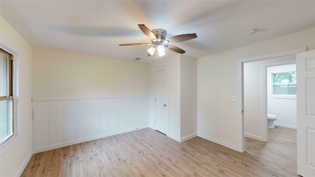 empty room featuring light hardwood / wood-style floors and ceiling fan