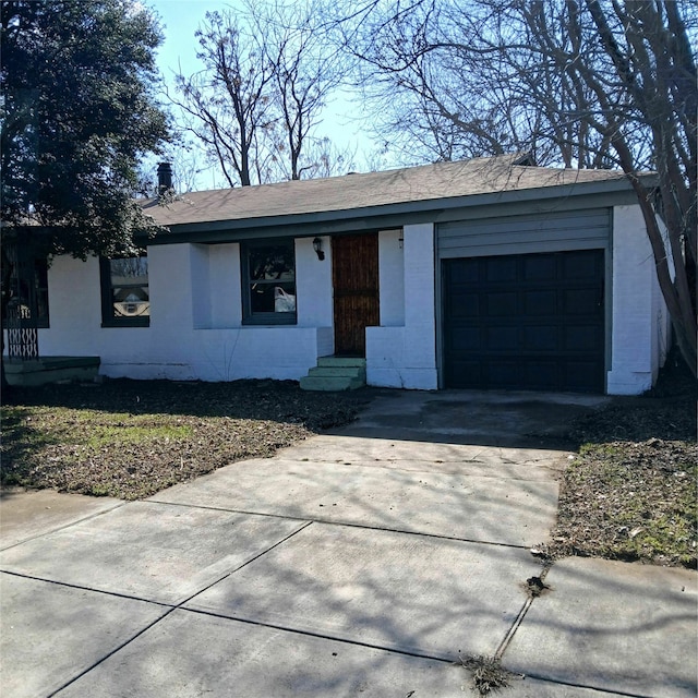 ranch-style home featuring a garage