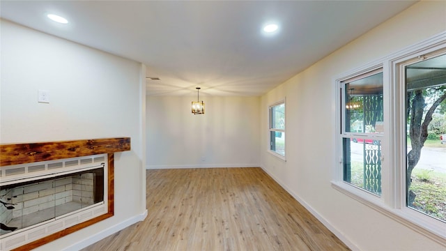 unfurnished living room featuring light hardwood / wood-style flooring